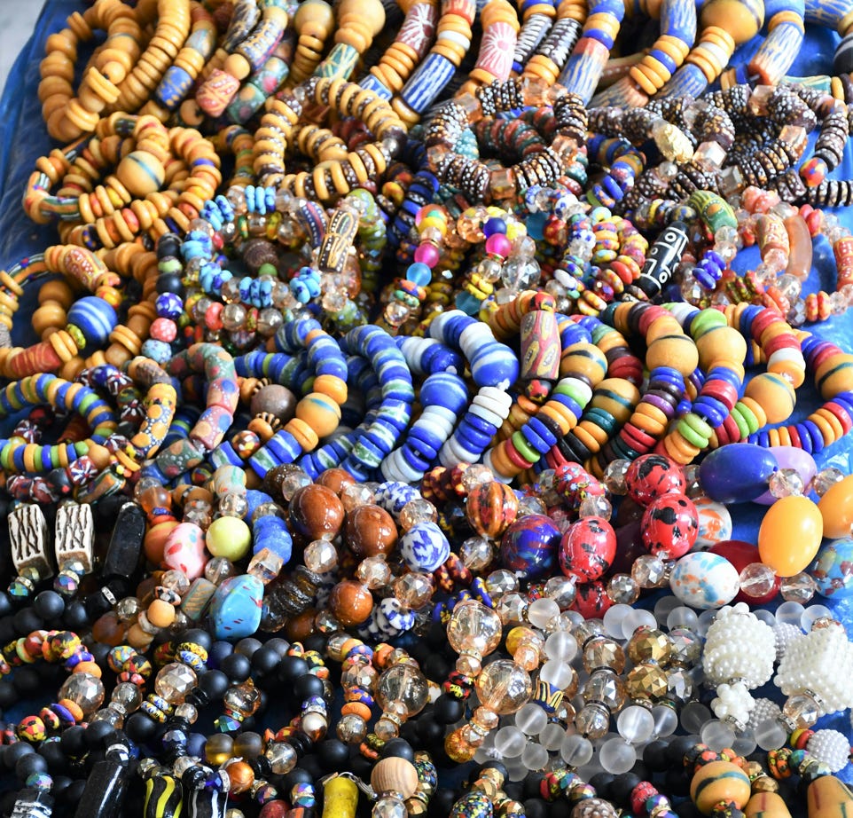 Man in White Long Sleeve Shirt Sitting on Yellow Chair